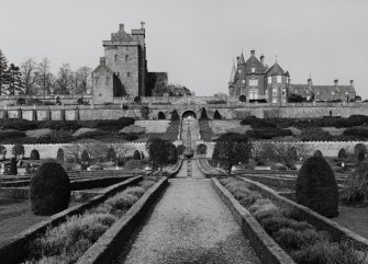 General view of keep, house and formal gardens with sundial from South.