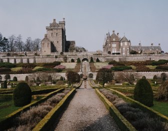 General view of keep, house and formal gardens with sundial from South.