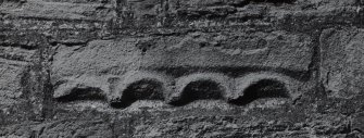 Dunning, St. Serf's Parish Church.
Detail of fragment of arcaded ornament on South side of wall.