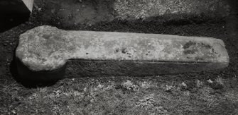 Medieval coped grave-cover in burial-ground, immediately S of church.