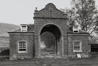 View of gatehouse and archway to courtyard from E