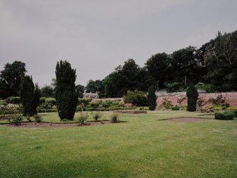 View of garden from SE showing gardeners house and glasshouses beyond