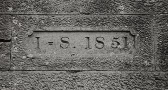 Detail of inscription above South doorway of mill cottage.
Insc: 'I = S 1851'.