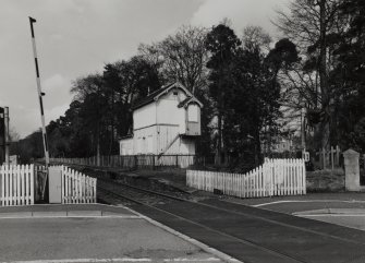 View from S, with level crossing in the foreground