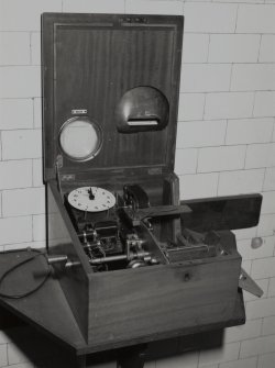Perth, Glover Street Works, Messrs. Dewar Distillery, interior.
North office block, detail of mechanism of "Gledhill Brook" clocking on machine in Welfare room.