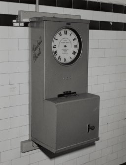 Perth, Glover Street Works, Messrs. Dewar Distillery, interior.
North office block, corridor adjacent to W.C.,  detail of "Gledhill Brook" clocking on machine.