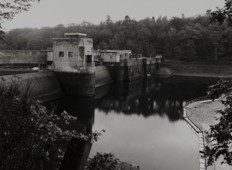 General view showing crest of drum gates (left) from NW