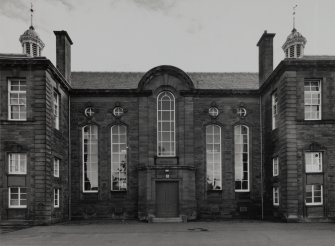 View of main entrance in central bays of NW elevation.