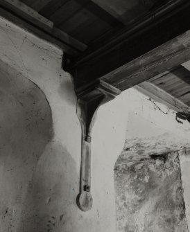 Interior.
Detail of iron wall bracket in basement.