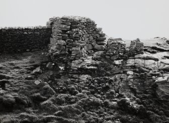 Remains of wall of Dun Briste site near South West cliff face, Isle of Berneray.