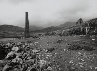 View from S of milling area, with surviving boiler house chimney in background.