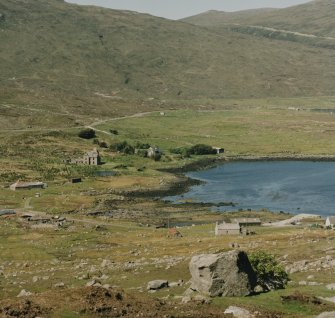 Distant view of castle from S, in the context of Loch Seaforth.