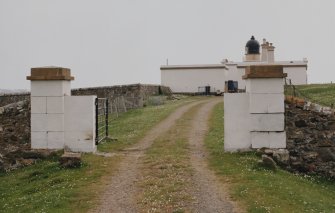 View from WSW of gates to lighthouse compound