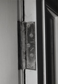 Detail of Northern Lighthouse Board hinge on door in keeper's house