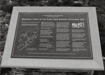 Detail of plaque explaining historical significance of cairn