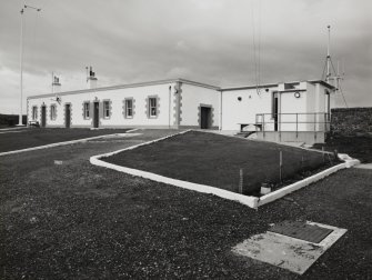 View of weather station outbuildings from the E Photographic survey 20-Aug-1992