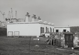 View of keeper's house from NE (with oil-rig construction yard's jacket nearing completion in background)