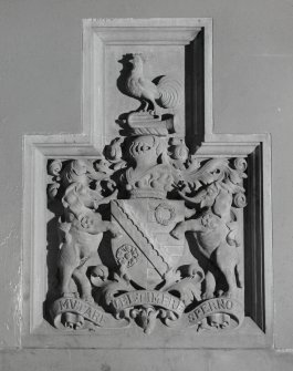 Interior. Ground floor, entrance hall, detail of coat of arms above fireplace