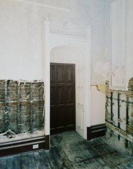 Interior. Ground floor, dining room, view of SE door and surround