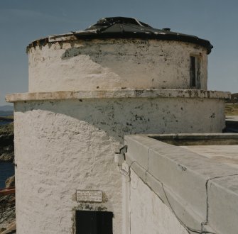 View from E of upper part of old tower, also showing commemorative plaque