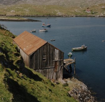 Herring Fishing Station: Elevated view of wooden building and pier from S