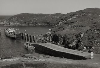 General view from W of ferry pier and ramp (Scalpay side), showing Isle of Rhum ferry prior to moving into position to receive cars and foot passengers