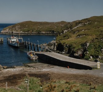 General view from W of ferry pier and ramp (Scalpay side), showing Isle of Rhum ferry prior to moving into position to receive cars and foot passengers