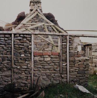Thatched house, detail of internal partition wall with stone infill