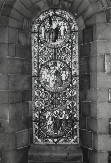 Interior. North chapel, view of stained glass window on east wall.