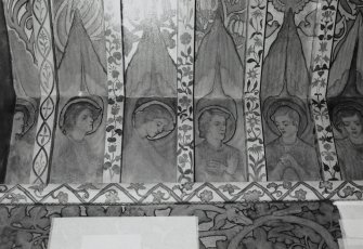 Interior. North chapel, detail of mural frieze depicting heads of angels.