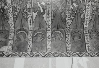 Interior. North chapel, detail of mural frieze depicting heads of angels.