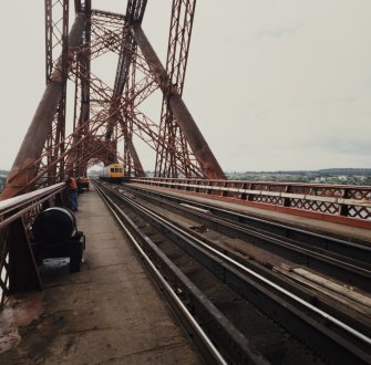 View along the track within the Queensferry erection with a Diesel Multiple Unit train (DMU) passing through the South portal.
