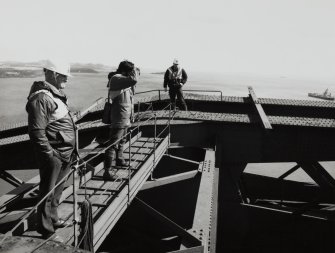 View of the Forth Bridge inspector along with Angus Lamb and Miles Oglethorpe (RCAHMS) on top of the Fife erection.