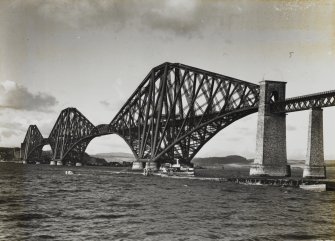 View of the bridge from the South West shore. With HMS Nelson or Rodney visible on horizon.