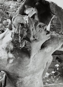 Lead sculpture by Charles Mackie in garden to South of main house, detail of head of Pan.