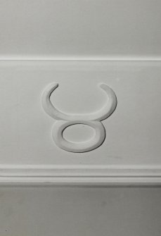 Ground floor, Music room, detail of relief symbol on cornice