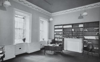 General interior view of the South West room on the ground floor, in use as an office.