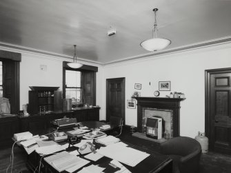 Edinburgh, 87 Giles Street, The Black Vaults, interior.
View of the first floor, West central room, The Director's Office, a large room with two windows, black fire surround, built in sink cabinet, and a large desk.
