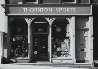 Genreal view of shop frontage from South of no.s 72-74.