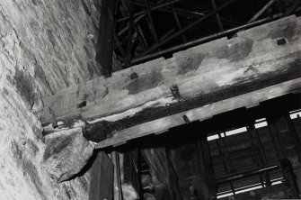 Interior-detail of end of laminated trussed floor beam