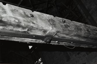 Interior-detail of underside of laminated trussed floor beam