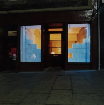 Detail of shop windows at Nos 52 and 54 High Street showing "Lux Europea" installation