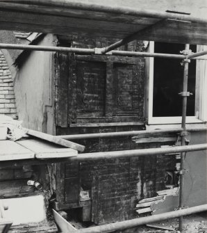 View from South West of gabled outhsot on Fourth FLoor, showing timber shutter and cladding below