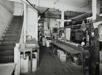 Interior. Lower ground floor. View of workshop from S