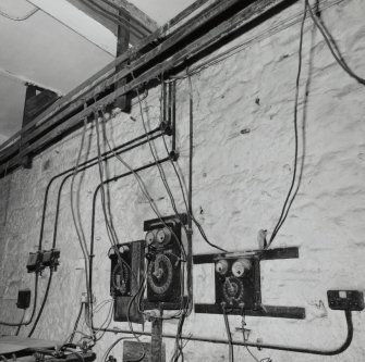 Interior. Lower ground floor. Workshop. Detail of control switches and overhead busbar