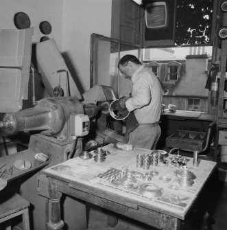 Interior. Ground floor. Machine room. Detail of staff and polishing machine