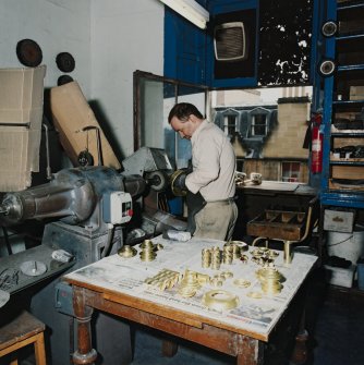 Interior. Ground floor. Machine room. Detail of staff and polishing machine