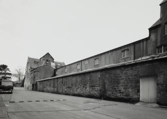 View from E along  S side of former floor maltings, built in 1857 and re-built in 1914