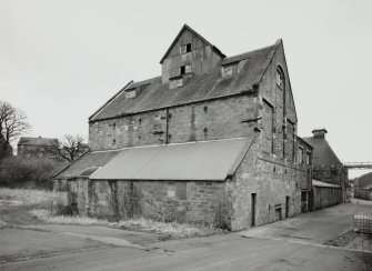 View from SW of barley silos at W end of block of former floor maltings, built in 1857 and re-built in 1914