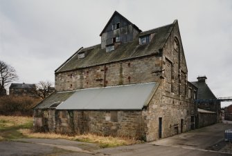 View from SW of barley silos at W end of block of former floor maltings, built in 1857 and re-built in 1914